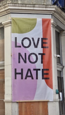 An empty college campus with a 'No Hate' banner hanging.