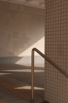 Close-up of senior-friendly safety features like handrails and non-slip flooring in a living room.