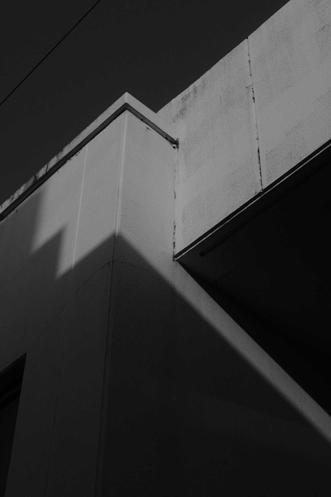 grayscale photo of concrete building