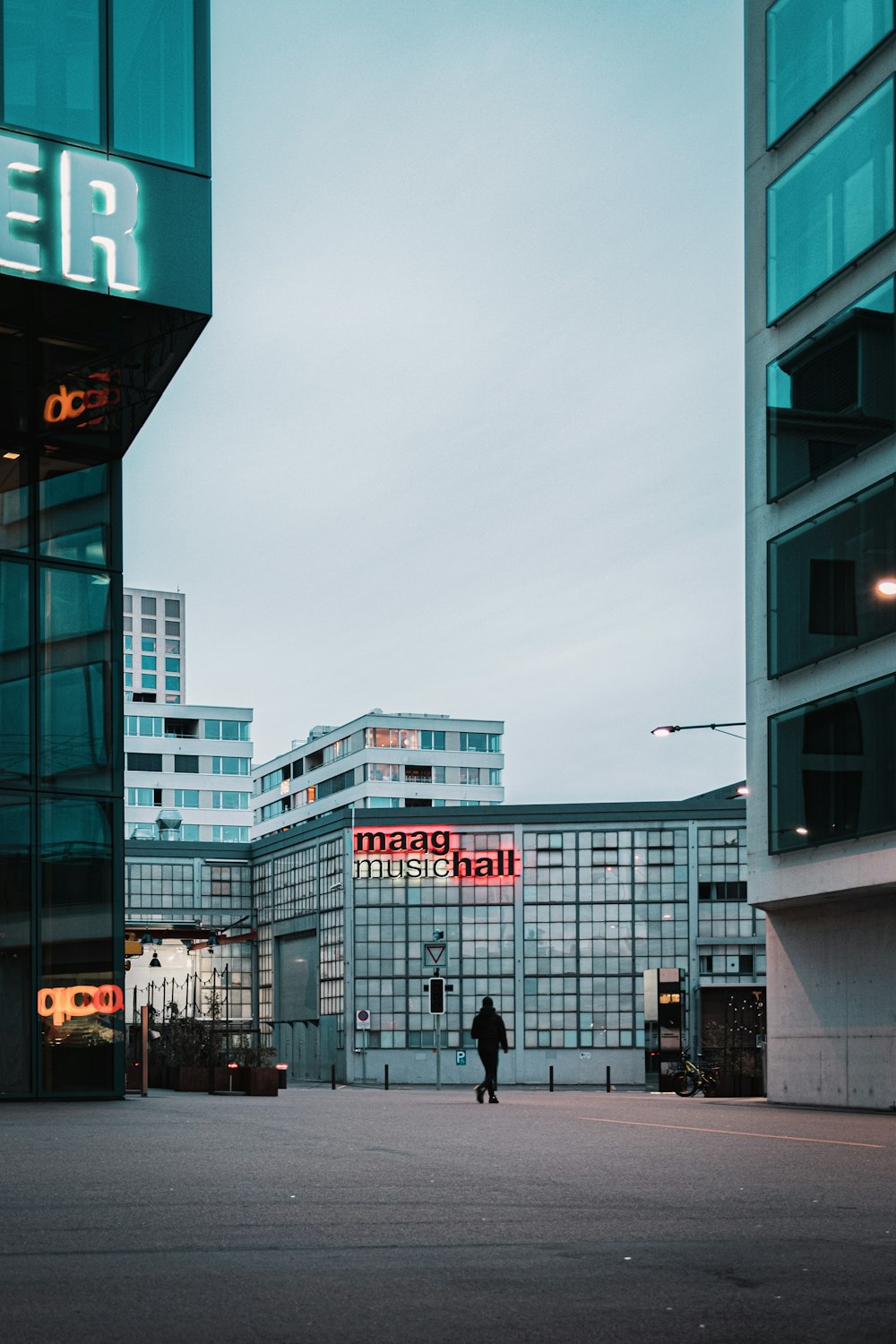 people walking on sidewalk near building during daytime