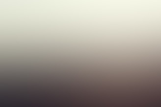 A blurred gradient image with smooth transitions between colors, creating an indistinct and hazy visual effect.