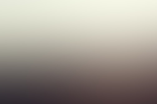 A blurred gradient image with smooth transitions between colors, creating an indistinct and hazy visual effect.