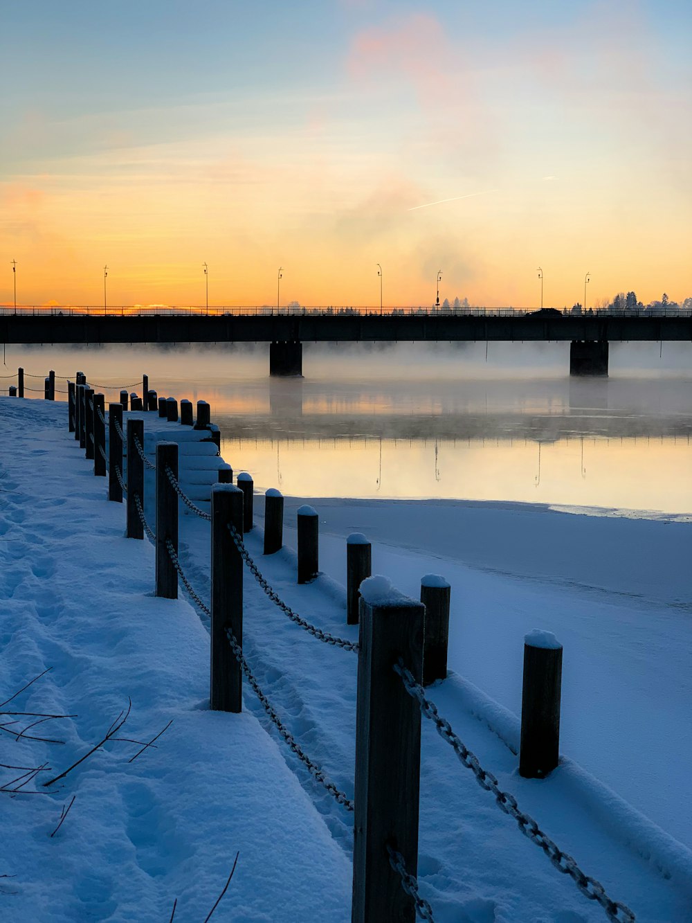 brown wooden dock on lake during daytime