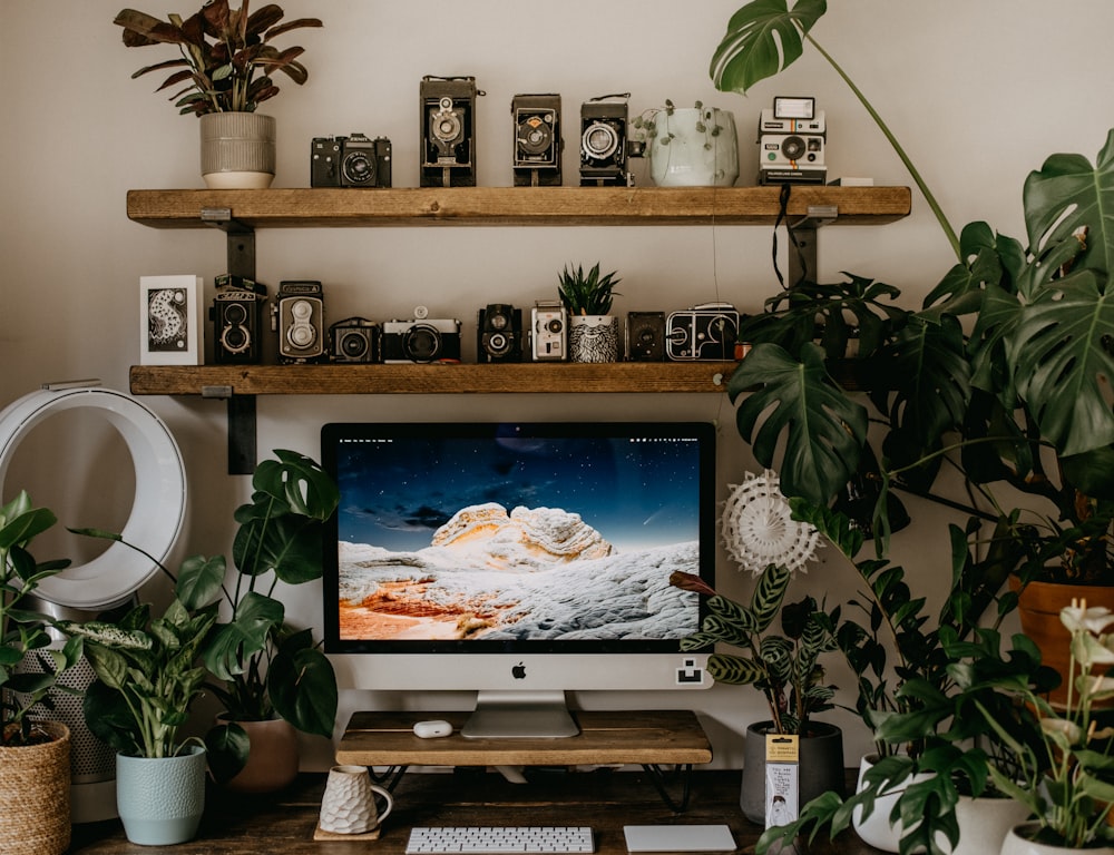 black flat screen tv on brown wooden tv rack