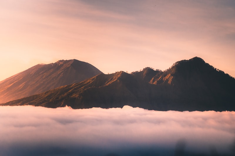Sunrise from the Mount Batur crater rim above a sea of clouds