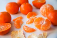 sliced orange fruits on white ceramic plate