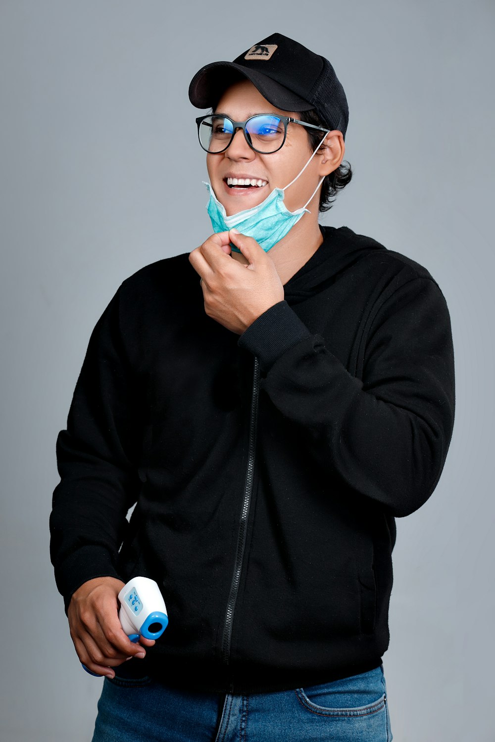 man in black zip up jacket wearing blue goggles