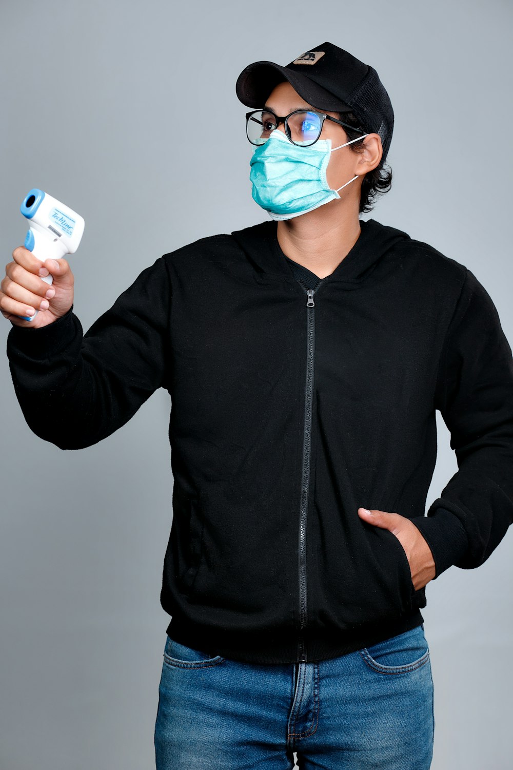 man in black zip up jacket wearing blue goggles