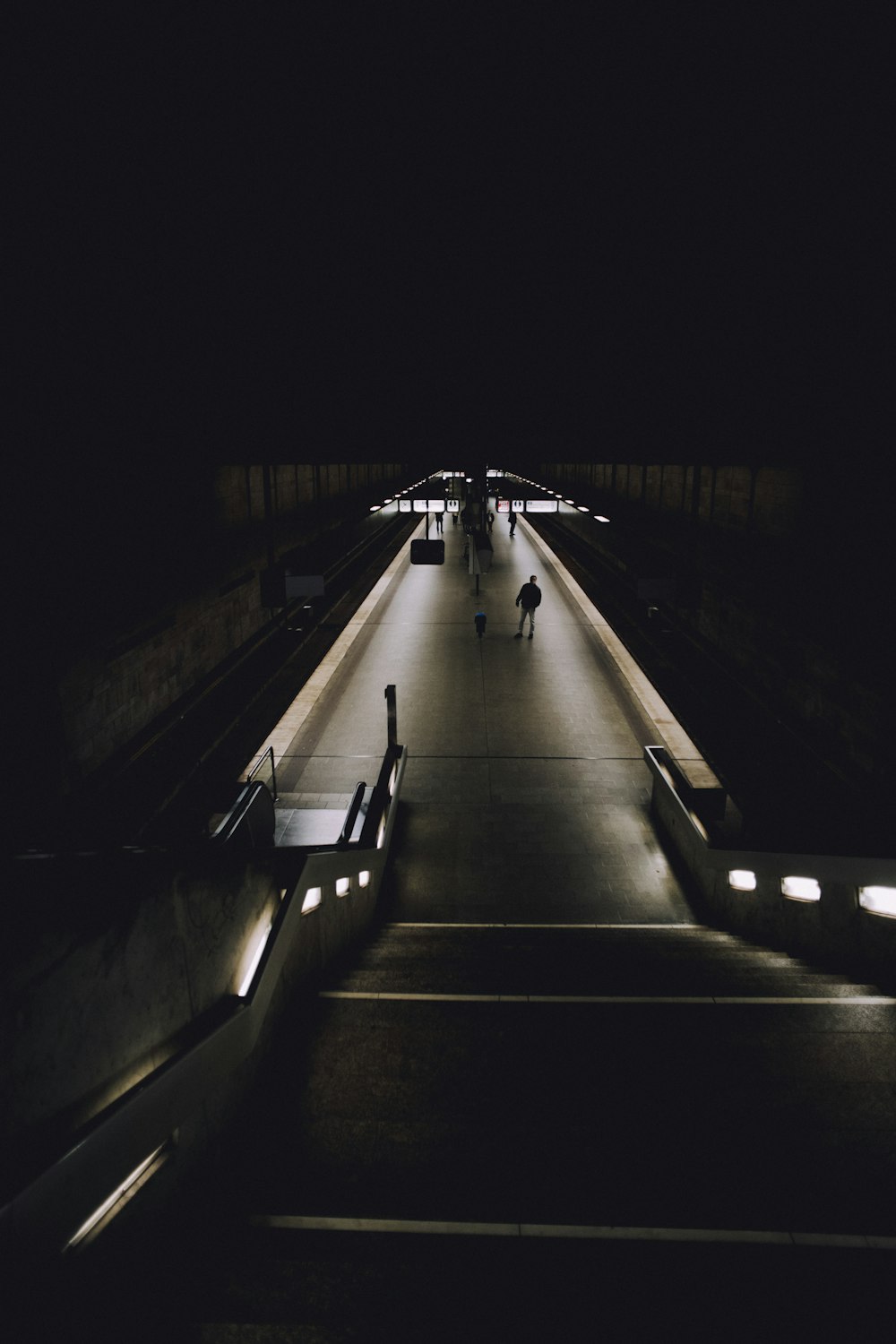 black and white tunnel with lights