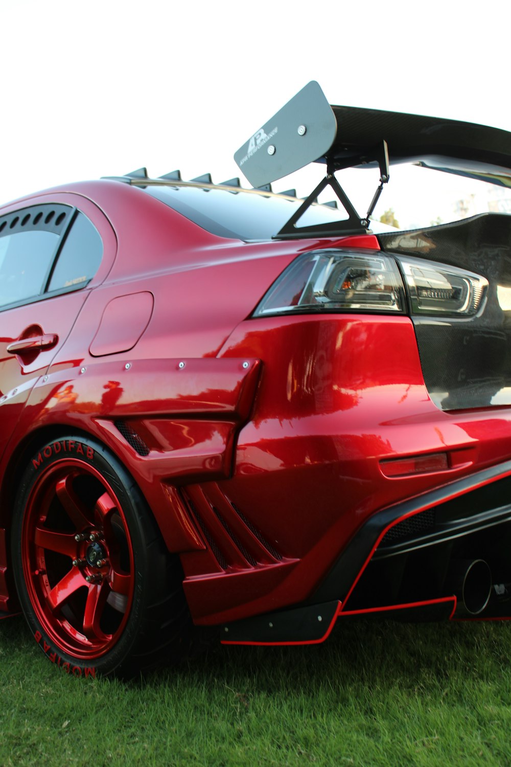 red and black car in a parking lot