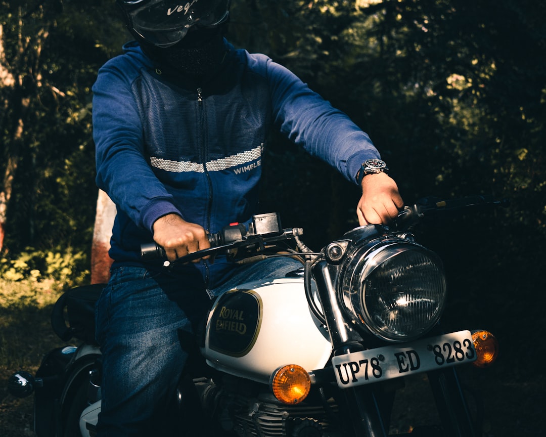man in blue jacket riding on motorcycle, Royal Enfield
