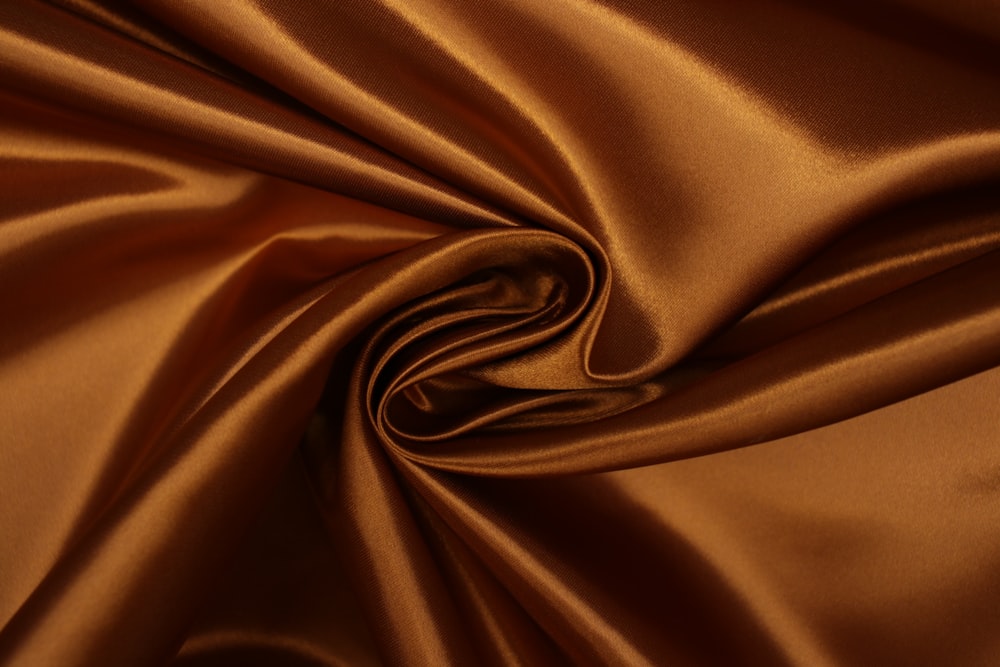 brown textile in close up photography