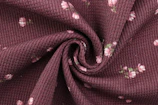 maroon and white floral textile