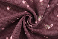 maroon and white floral textile