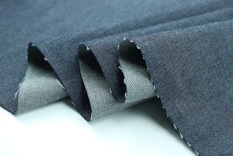 black strap on blue textile