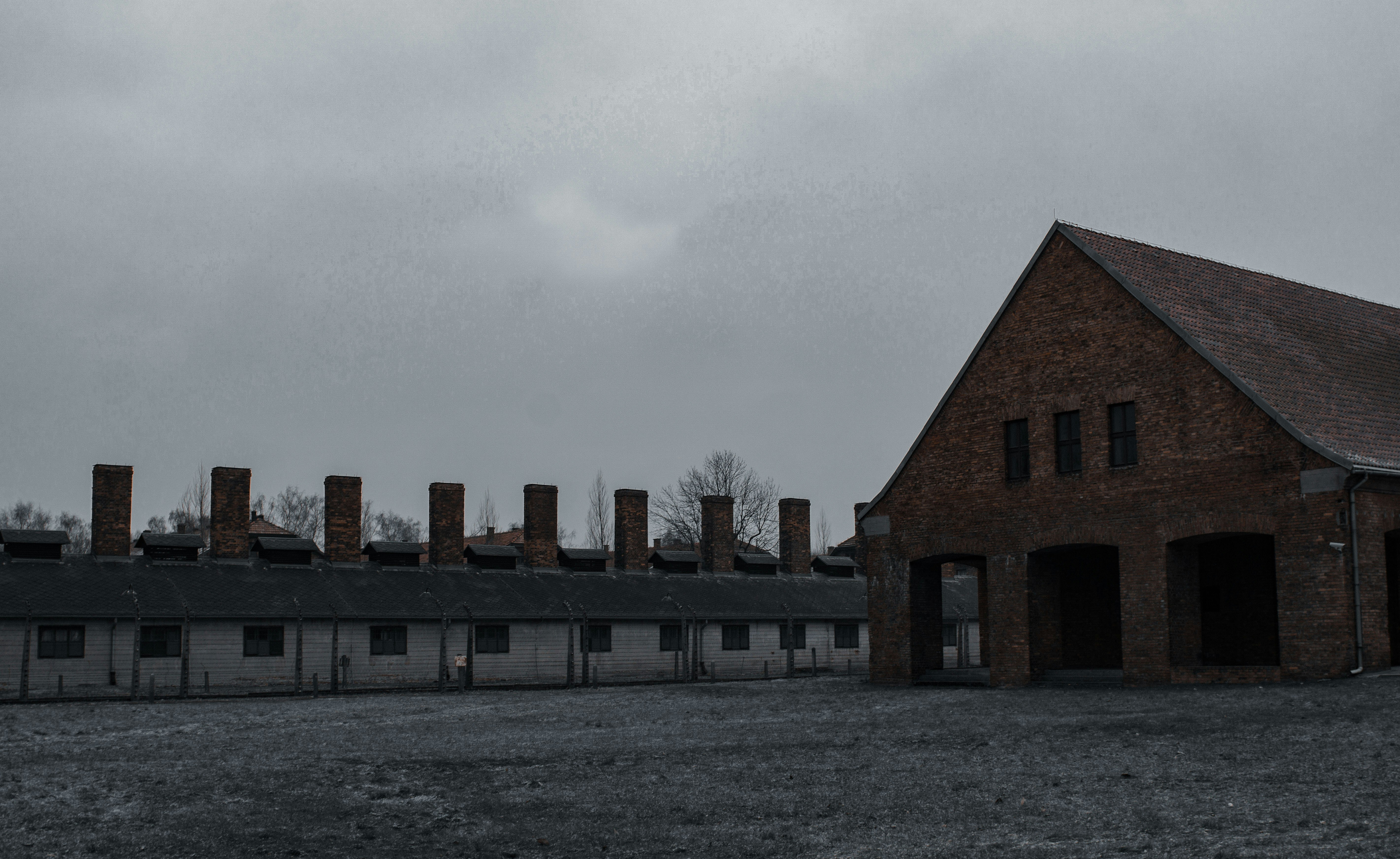 brown and white concrete building under white sky during daytime