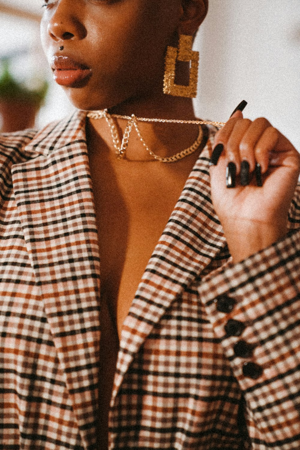 woman in white and black checkered button up shirt