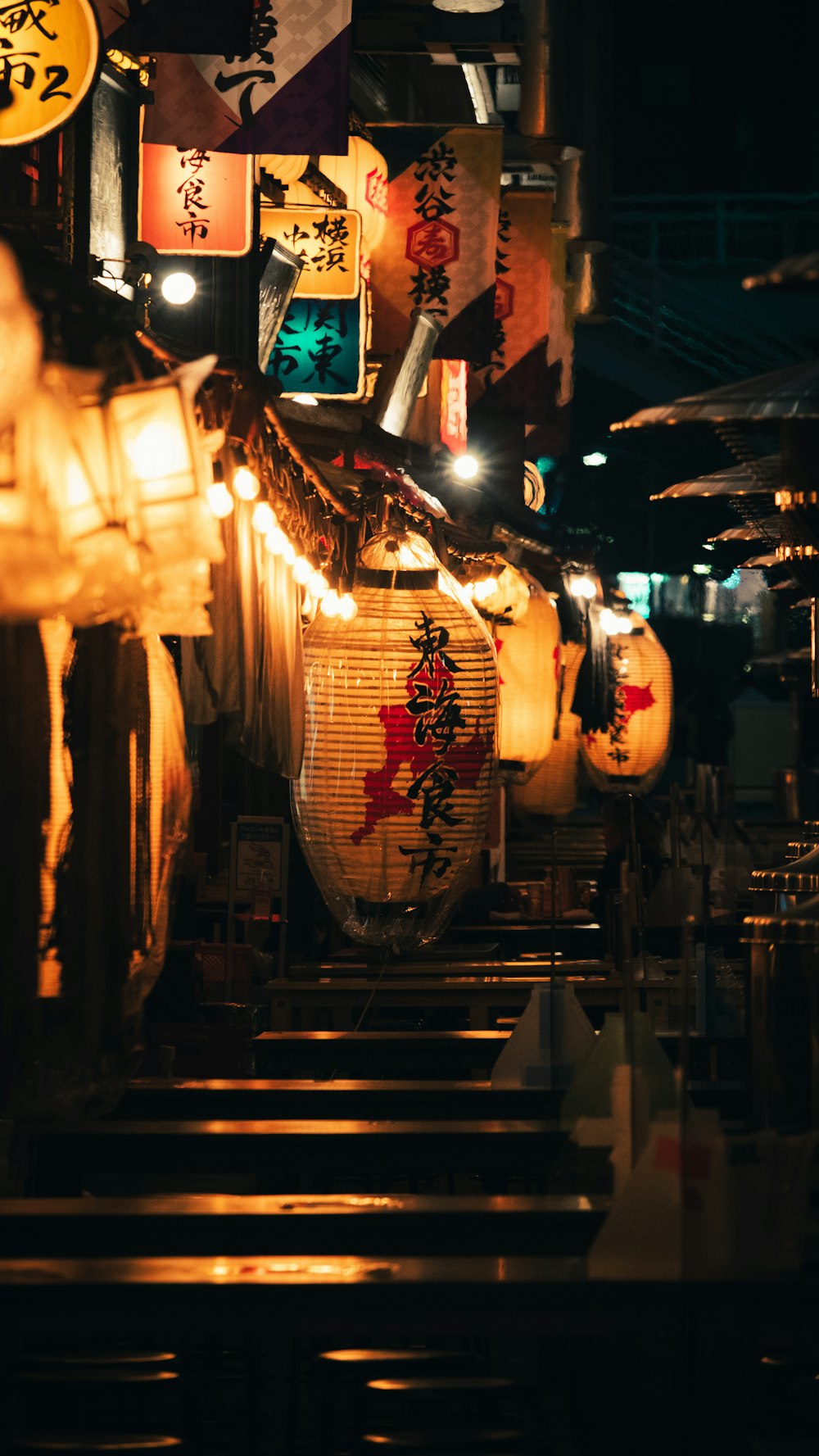 white paper lanterns hanged on ceiling