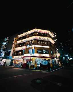 A neon-lit Tokyo street blending cyberpunk vibes with minimalist Japanese library aesthetics.