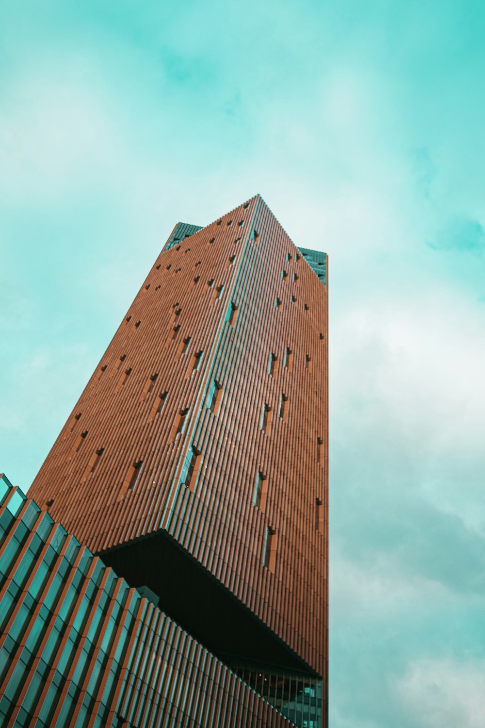 a tall brick building with a sky background