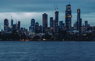 A modern city skyline at dusk, symbolizing economic growth.