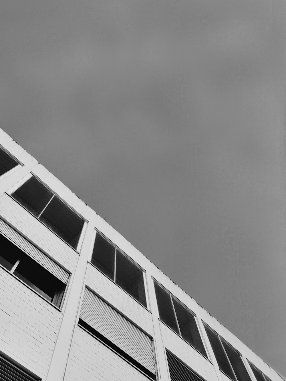 grayscale photo of concrete building