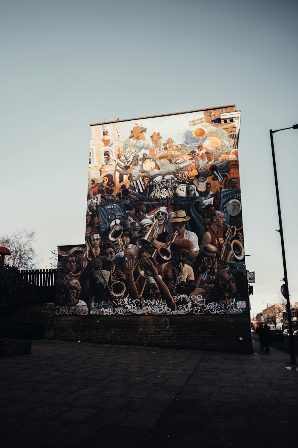 people riding horses painting on brown concrete wall