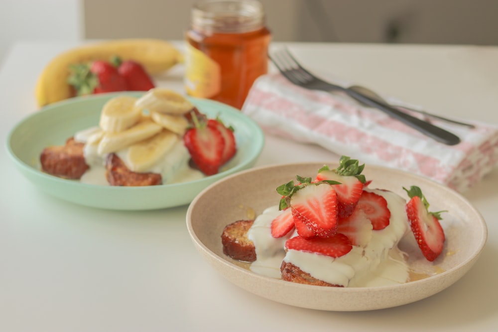 sliced strawberries on white ceramic plate