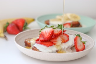 a plate of food with strawberries and bananas