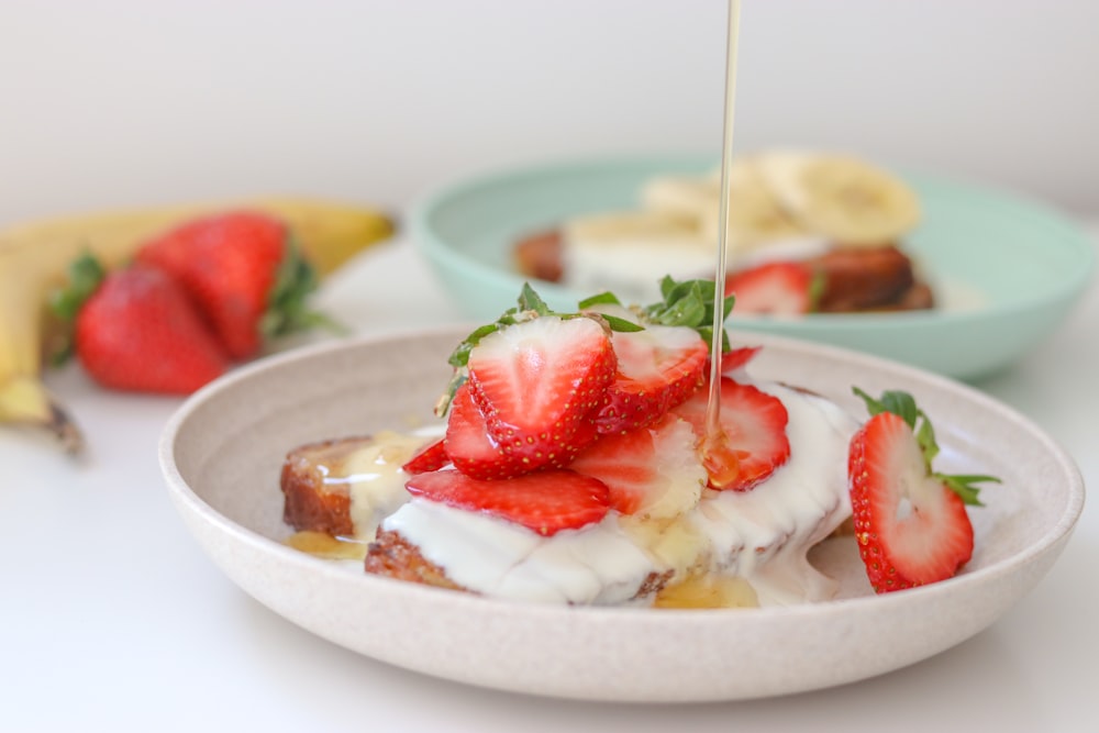 a plate of food with strawberries and bananas