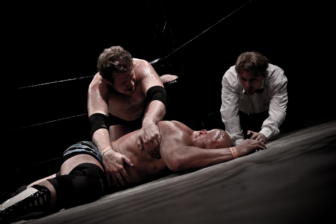 2 men lying on floor,