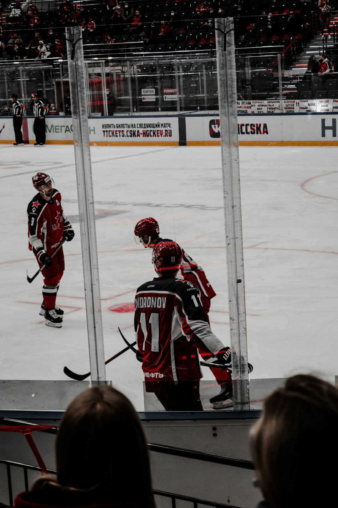 2 men playing ice hockey