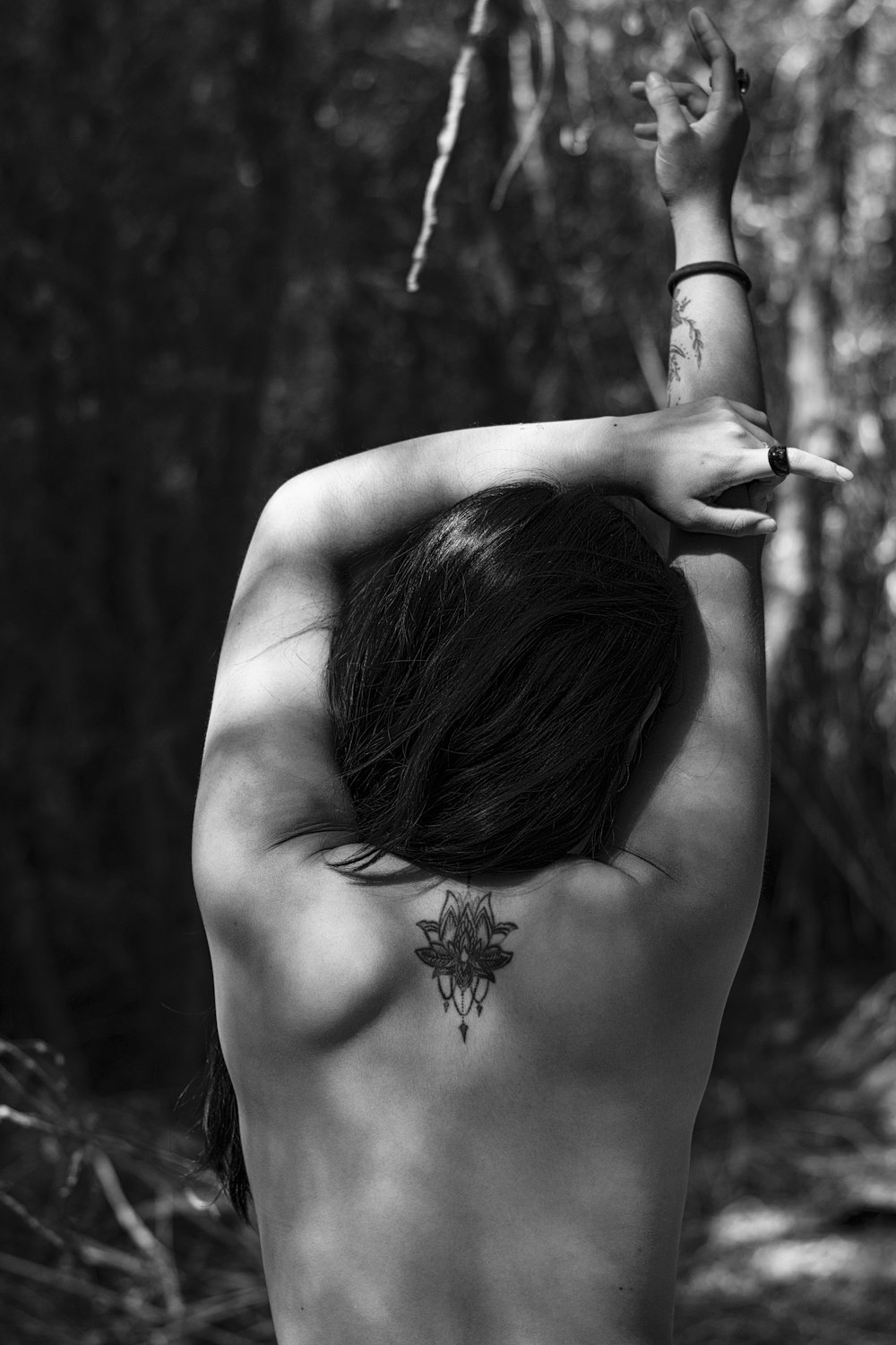 grayscale photo of woman with flower on her hair