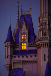 Illustration of a medieval castle tower transformed into a high-tech IT hub buzzing with glowing screens.