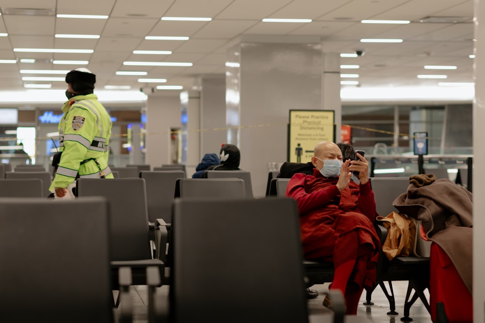 people sitting on black chairs