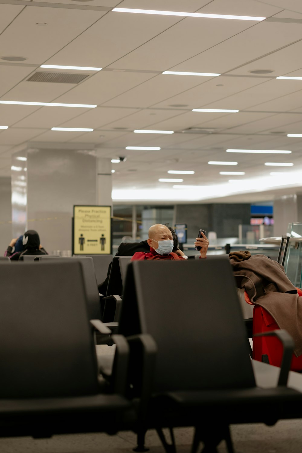 people sitting on black chairs