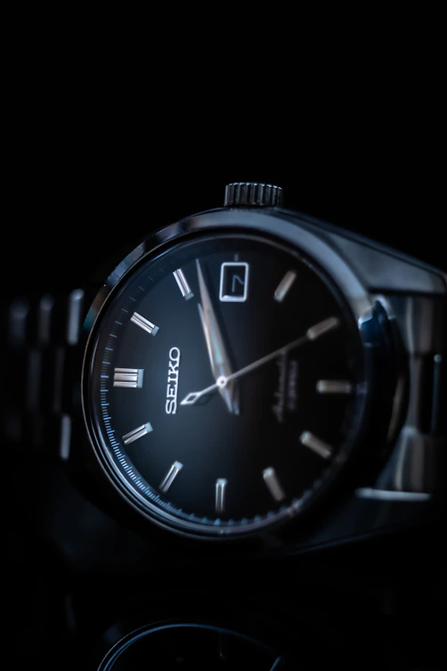 silver and black analog watch