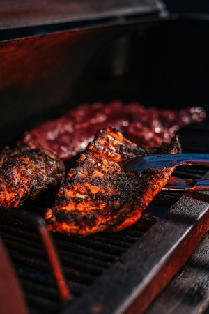 Grilled meat and barbecue plates ready to be served at a local restaurant counter