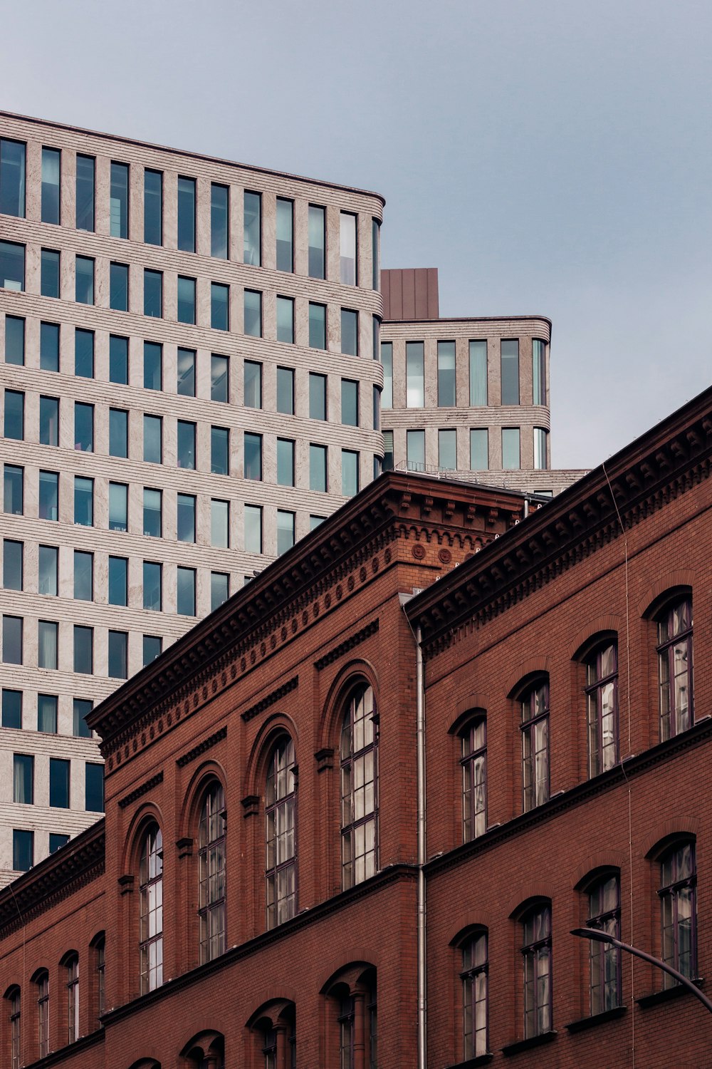 brown concrete building under gray sky during daytime