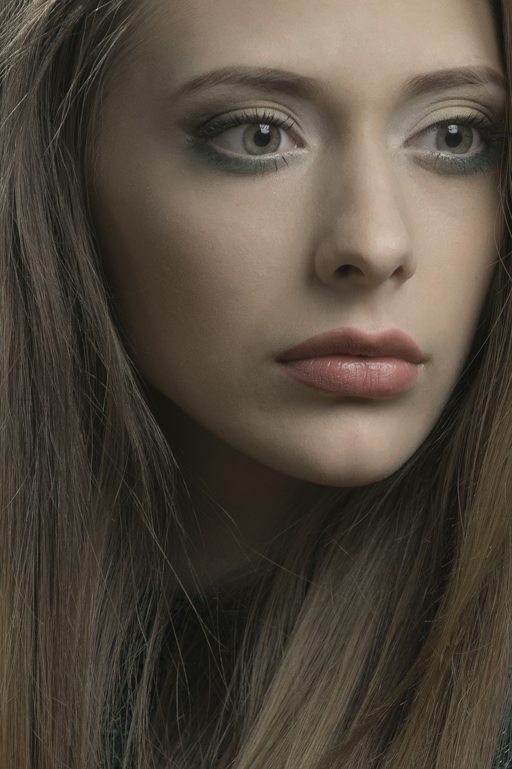 woman with red lipstick and black mascara