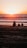 A group of travelers enjoying a sunset at a beach in Bali.