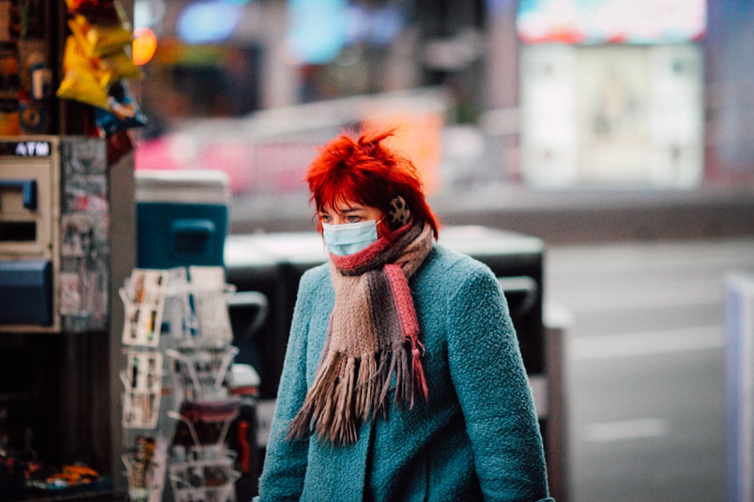 woman in blue sweater with red hair