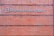 A rectangular brick wall with a sign that has the words 'Planned Parenthood' written in metal letters attached to it.