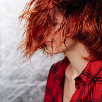 girl in red and black plaid shirt