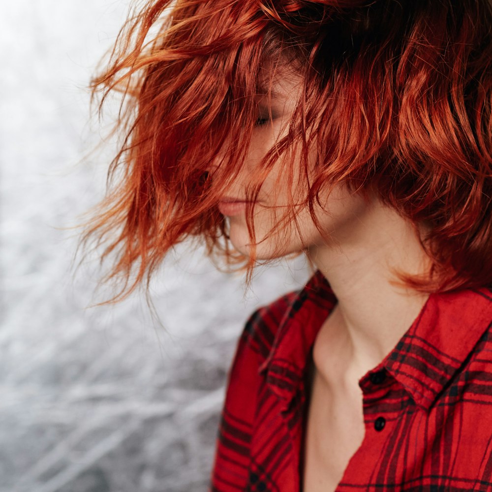 girl in red and black plaid shirt