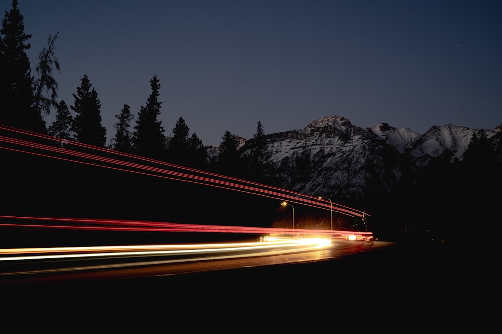 time lapse photography of cars on road during night time