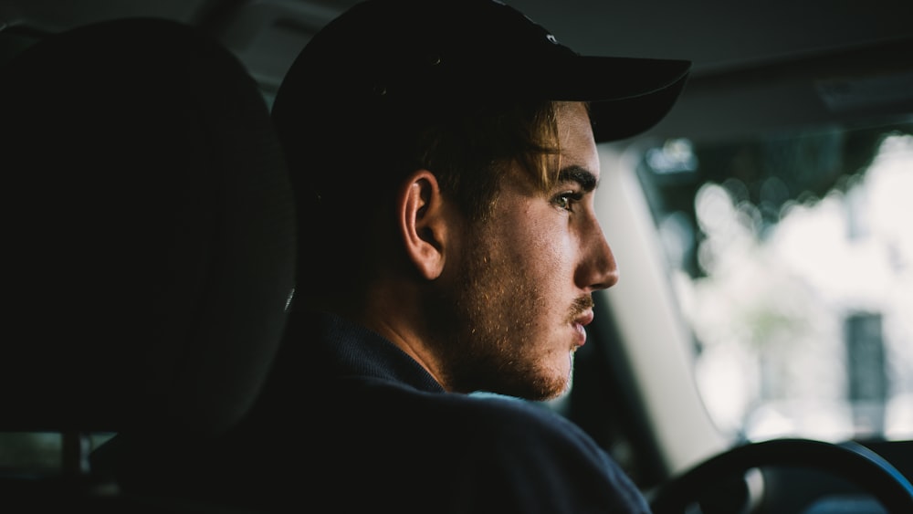 man in black hat and black shirt