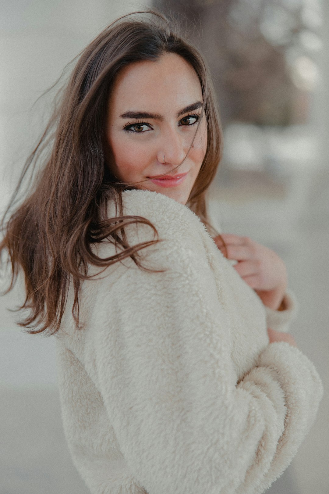 woman in white fur coat