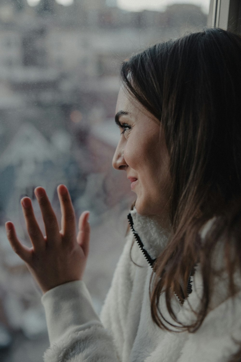 woman in white coat smiling