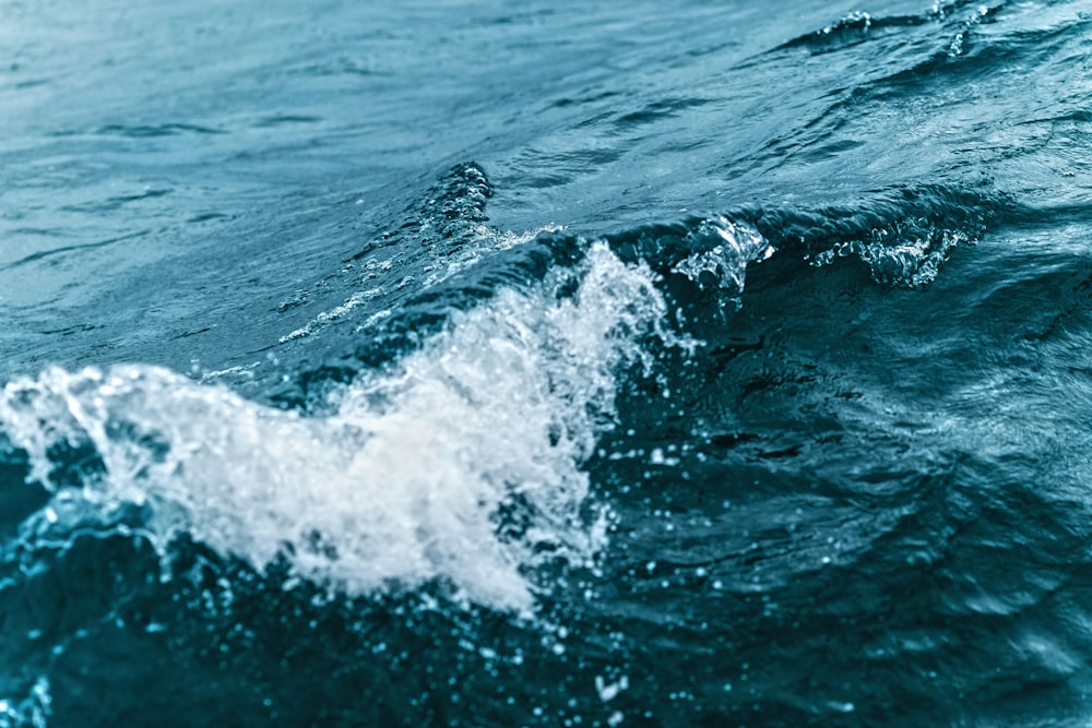 water waves on blue ocean water during daytime